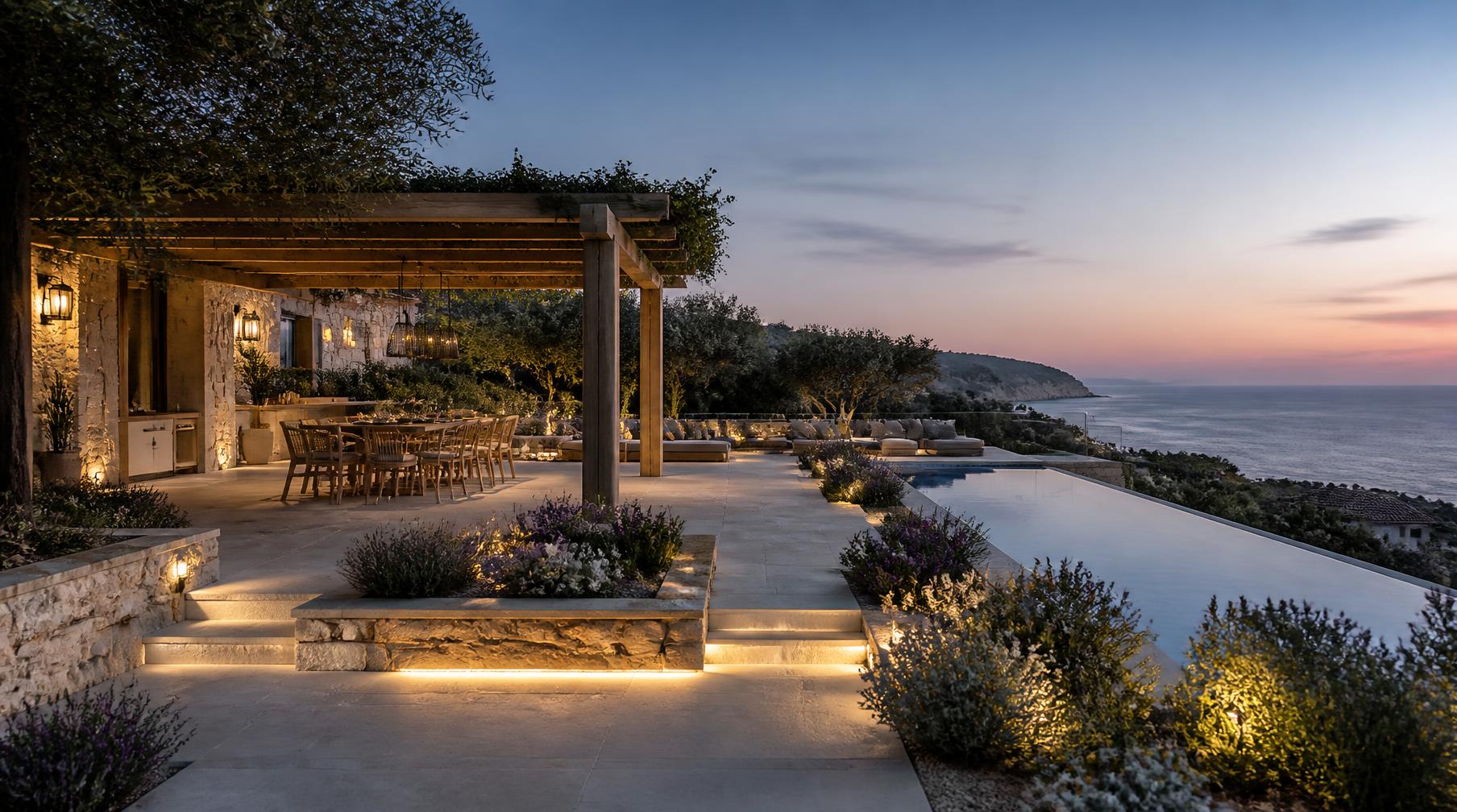 Completed Cottesloe residence landscape with terrace, pergola dining, pool and lit planting at dusk